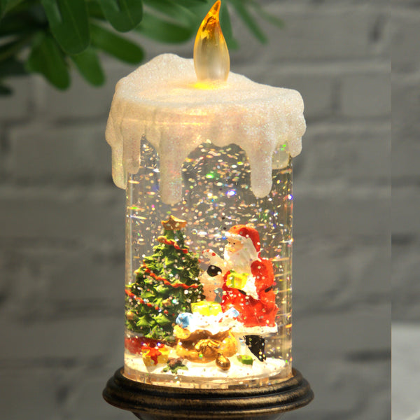 Holiday decorations, beautiful christmas snowglobe candle with lights and music, santa with reindeers by Sona Casa