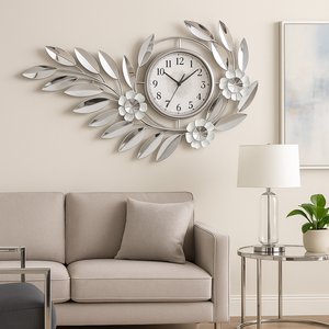 Large silver floral metal wall clock above a sofa — Sona Casa