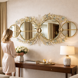 Gold butterfly wall mirror above an entryway console — Sona Casa