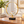 Gold-tone ring and clear crystal ball table sculpture on a black base