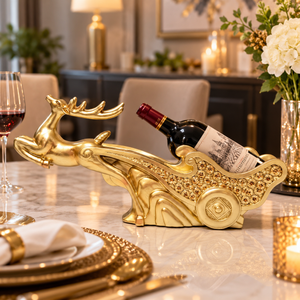 Golden deer sleigh wine bottle holder displayed on a dining table