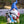 Blue Hat Bathing Dog Gnome With Pump - Polyresin Garden Statue With Solar LED Lights by Sona Casa